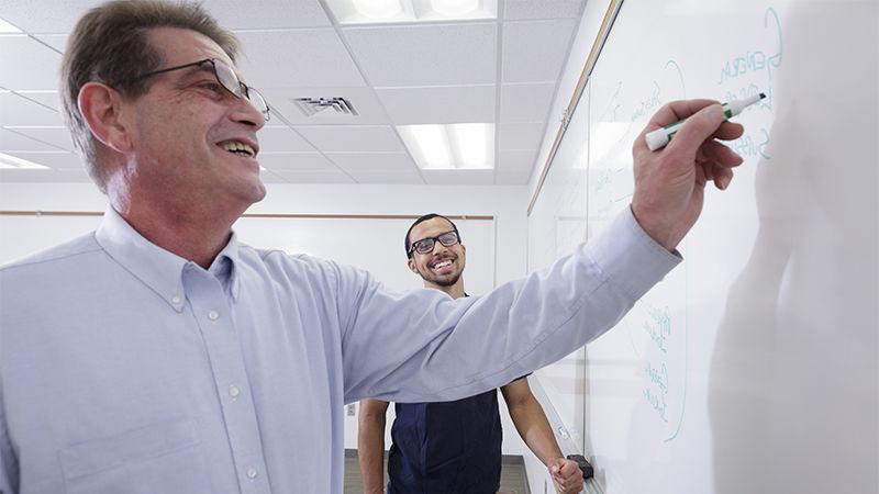 Penn State Abington (near Philadelphia) professor writing on whiteboard